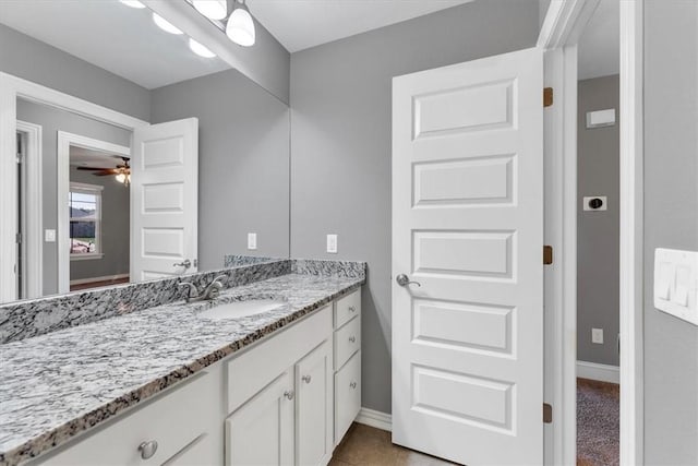 7326 Drury Ave, Springdale, AR 72762 - bathroom featuring vanity, baseboards, and a ceiling fan