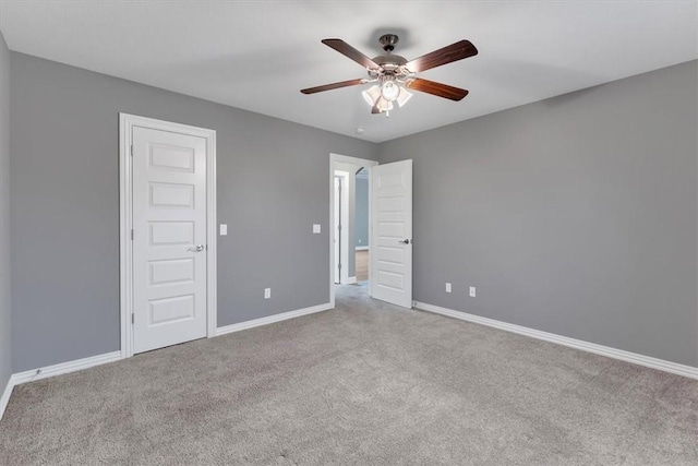 7326 Drury Ave, Springdale, AR 72762 - unfurnished bedroom featuring carpet, baseboards, and ceiling fan