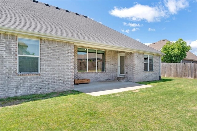 7326 Drury Ave, Springdale, AR 72762 - rear view of property featuring a shingled roof, a patio, and brick siding