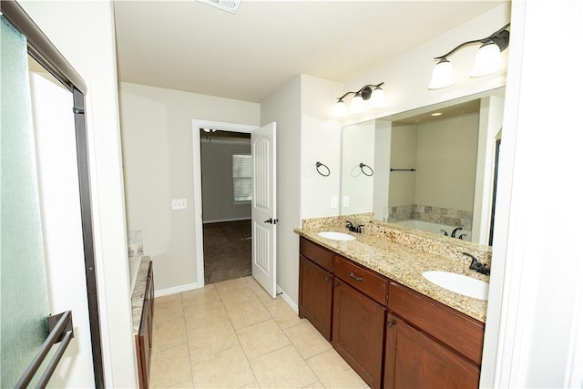 904 SW Caprington St, Bentonville, AR 72712 - bathroom featuring double vanity, a bath, tile patterned floors, and baseboards