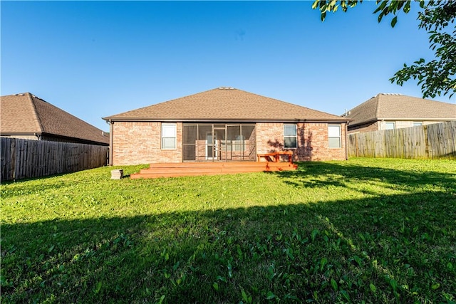 904 SW Caprington St, Bentonville, AR 72712 - rear view of house featuring brick siding, a deck, and a sunroom