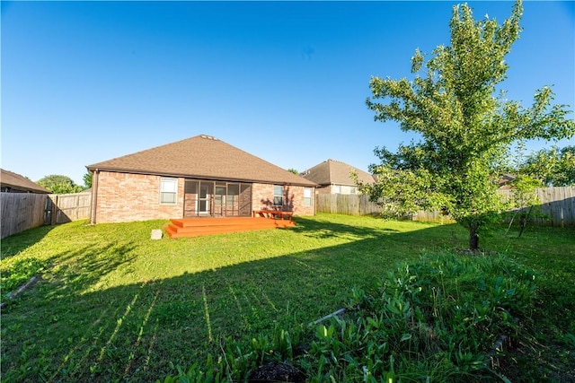 904 SW Caprington St, Bentonville, AR 72712 - rear view of house with brick siding and a wooden deck