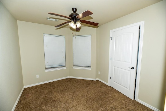 904 SW Caprington St, Bentonville, AR 72712 - spare room with carpet floors, a ceiling fan, and baseboards