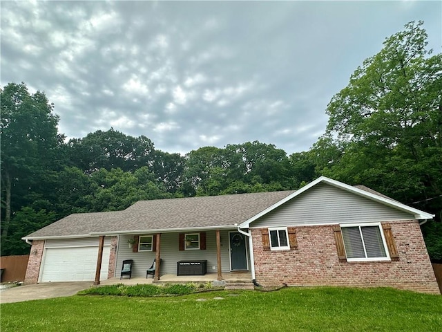 9193 Grimes Dr, Rogers, AR 72756 - ranch-style house with covered porch, brick siding, an attached garage, a front lawn, and concrete driveway
