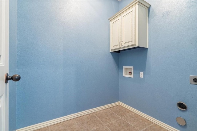 11029 Coleman Ct, Farmington, AR 72730 - laundry room with baseboards, electric dryer hookup, hookup for a washing machine, cabinet space, and tile patterned flooring