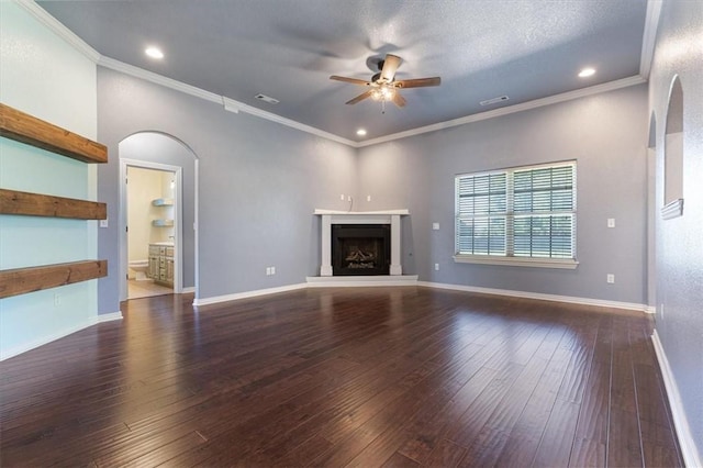 11029 Coleman Ct, Farmington, AR 72730 - unfurnished living room featuring arched walkways, a ceiling fan, a fireplace with raised hearth, wood-type flooring, and baseboards