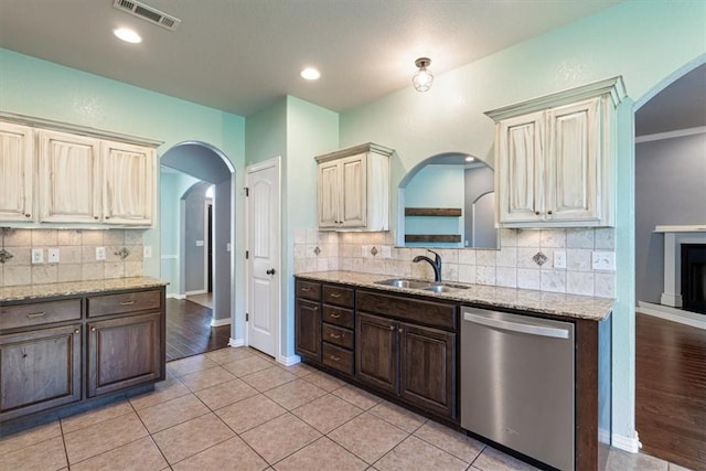 11029 Coleman Ct, Farmington, AR 72730 - kitchen with stainless steel dishwasher, a sink, backsplash, baseboards, and recessed lighting