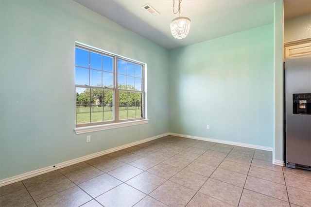 11029 Coleman Ct, Farmington, AR 72730 - empty room featuring light tile patterned flooring, baseboards, and a chandelier