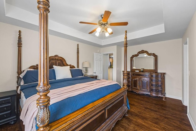 340 Mckissic Spring Rd, Centerton, AR 72719 - bedroom with a raised ceiling, wood finished floors, and baseboards