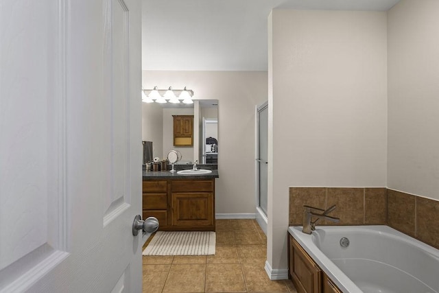 340 Mckissic Spring Rd, Centerton, AR 72719 - full bath with vanity, a bath, tile patterned floors, a shower with door, and baseboards