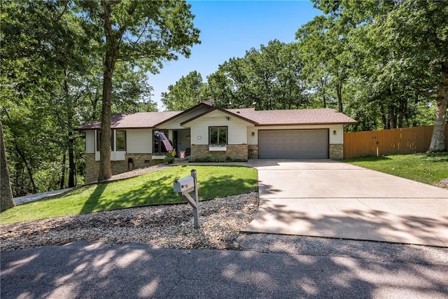 12 Drayton Ln, Bella Vista, AR 72715 - view of front of house featuring a garage and concrete driveway