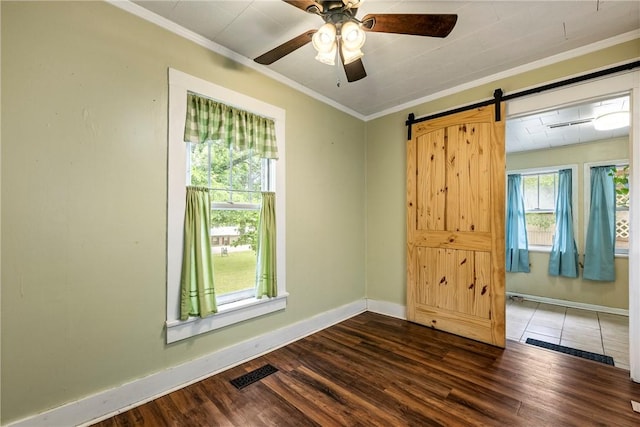 19574 Sonora Rd, Springdale, AR 72764 - empty room featuring ornamental molding, baseboards, ceiling fan, wood finished floors, and a barn door