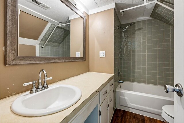 19574 Sonora Rd, Springdale, AR 72764 - full bath featuring toilet, washtub / shower combination, vanity, and wood finished floors