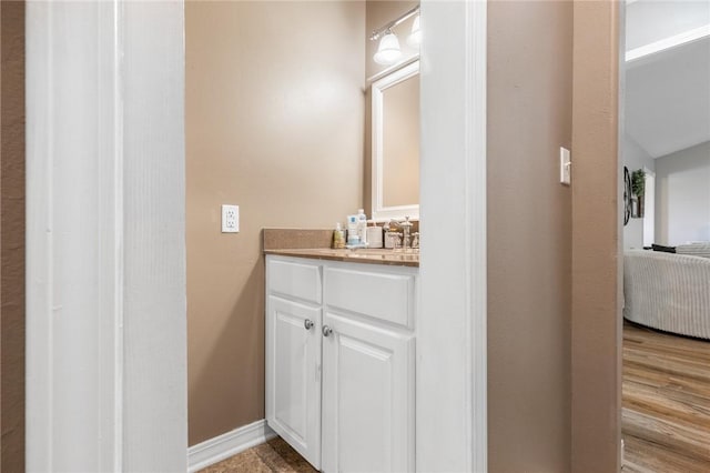1525 Meadow Ct, Green Forest, AR 72638 - bathroom featuring vanity and wood finished floors