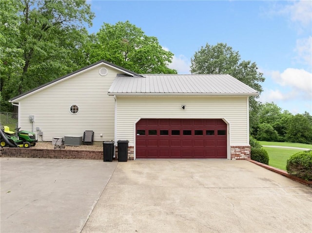 1525 Meadow Ct, Green Forest, AR 72638 - view of home's exterior featuring concrete driveway, a garage, and metal roof