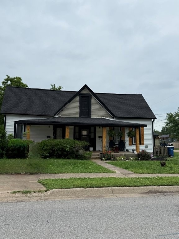 700 NW 2nd St, Bentonville, AR 72712 - view of front facade featuring covered porch and a shingled roof