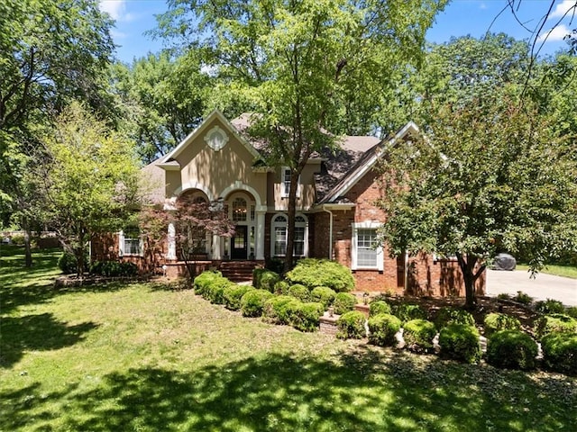 1325 Avery Pl, Siloam Springs, AR 72761 - view of front facade with a front yard, brick siding, and concrete driveway