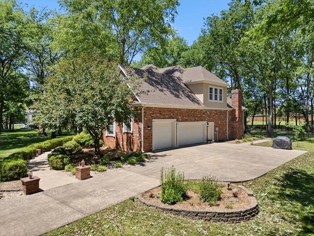 1325 Avery Pl, Siloam Springs, AR 72761 - view of home's exterior featuring brick siding, concrete driveway, a garage, and a lawn