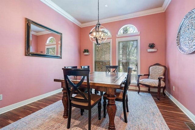 1325 Avery Pl, Siloam Springs, AR 72761 - dining space with a chandelier, dark wood-style floors, crown molding, and baseboards