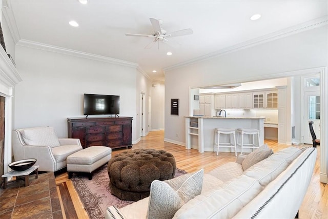 1325 Avery Pl, Siloam Springs, AR 72761 - living room with ornamental molding, a ceiling fan, recessed lighting, baseboards, and light wood-style floors