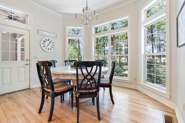1325 Avery Pl, Siloam Springs, AR 72761 - dining space featuring a chandelier, light wood-type flooring, baseboards, and ornamental molding