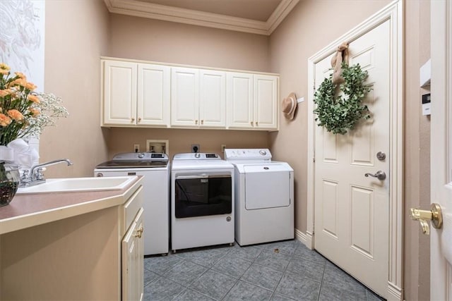 1325 Avery Pl, Siloam Springs, AR 72761 - laundry area featuring washer and dryer, cabinet space, ornamental molding, and light tile patterned floors