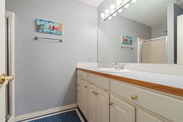 1325 Avery Pl, Siloam Springs, AR 72761 - full bathroom with vanity, a stall shower, tile patterned floors, and baseboards