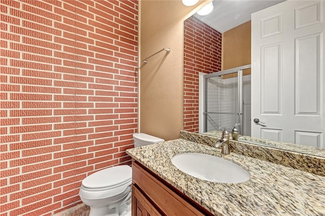 289 County Road 1521, Eureka Springs, AR 72632 - bathroom with toilet, vanity, a stall shower, a textured wall, and brick wall