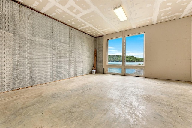 289 County Road 1521, Eureka Springs, AR 72632 - unfurnished room with concrete floors and a water view