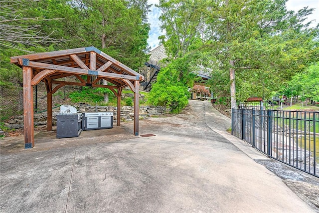 289 County Road 1521, Eureka Springs, AR 72632 - view of patio with an outdoor kitchen and a gazebo