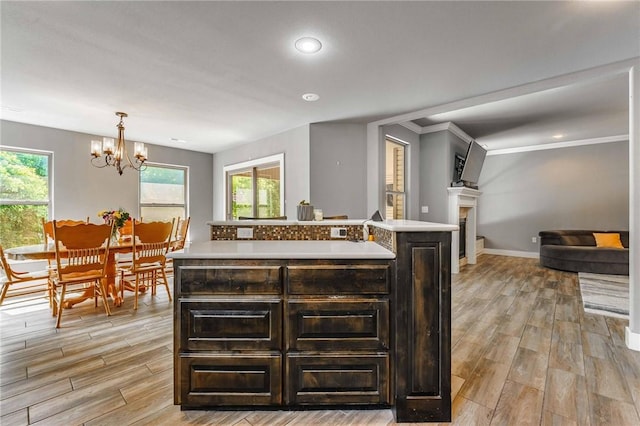 960 Glass St, Cave Springs, AR 72718 - kitchen featuring light countertops, light wood finished floors, healthy amount of natural light, a chandelier, and recessed lighting