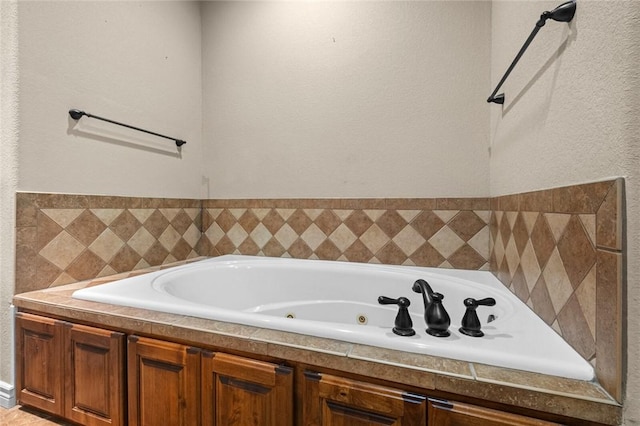 8 Allonby Cir, Bella Vista, AR 72714 - bathroom featuring a tub with jets and a textured wall
