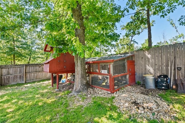 8 Allonby Cir, Bella Vista, AR 72714 - fenced backyard with exterior structure and an outdoor structure