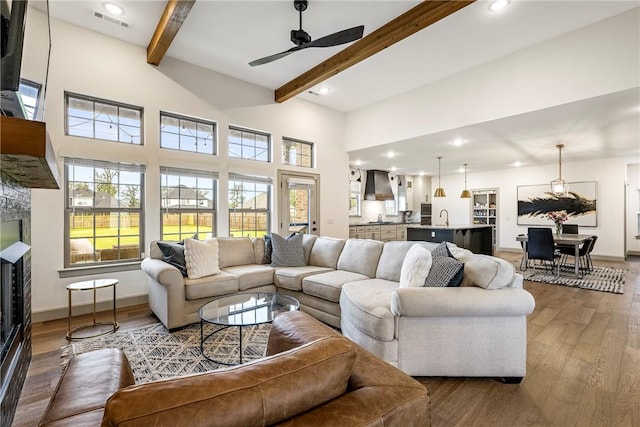 839 Saffron Ave, Tontitown, AR 72762 - living room with beamed ceiling, wood finished floors, a ceiling fan, recessed lighting, and baseboards