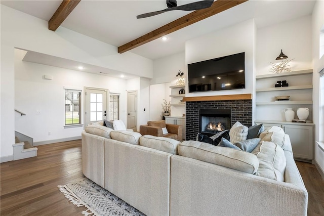 839 Saffron Ave, Tontitown, AR 72762 - living area featuring beamed ceiling, wood finished floors, a ceiling fan, a tiled fireplace, and recessed lighting