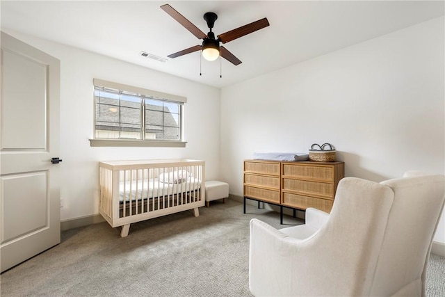 839 Saffron Ave, Tontitown, AR 72762 - carpeted bedroom featuring a crib, a ceiling fan, and baseboards