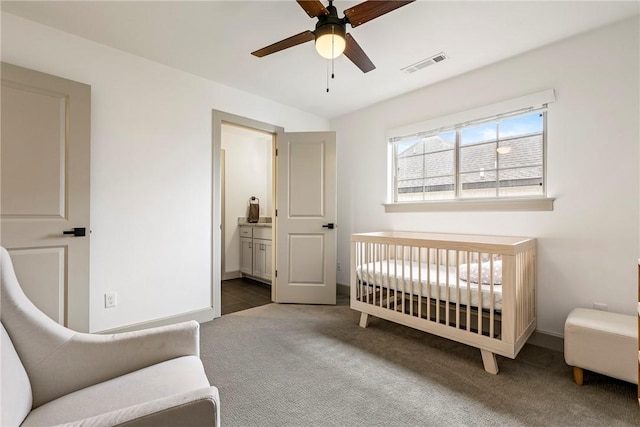 839 Saffron Ave, Tontitown, AR 72762 - bedroom featuring carpet floors, baseboards, a crib, connected bathroom, and a ceiling fan