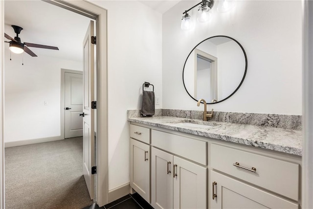 839 Saffron Ave, Tontitown, AR 72762 - bathroom featuring vanity, ceiling fan, and baseboards