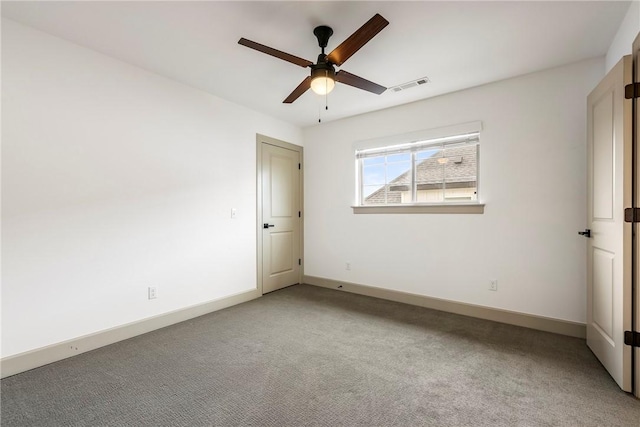 839 Saffron Ave, Tontitown, AR 72762 - spare room with a ceiling fan, light colored carpet, and baseboards