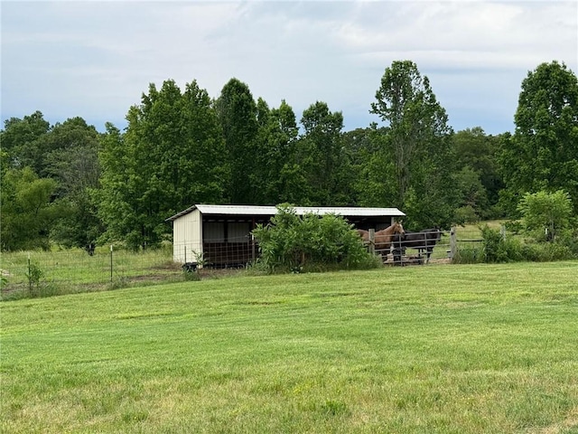 12088 State Highway 28, Dardanelle, AR 72834 - view of yard featuring an outbuilding, a view of trees, and a pole building