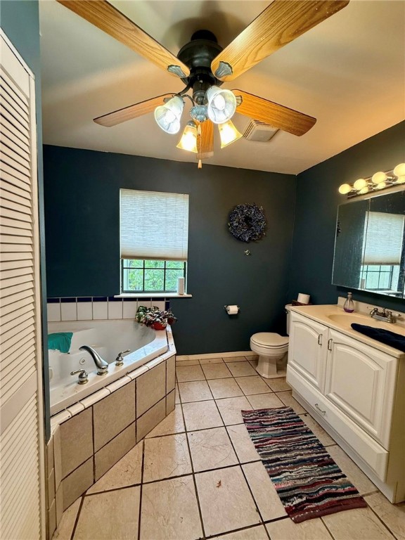 12088 State Highway 28, Dardanelle, AR 72834 - full bathroom with a whirlpool tub, vanity, ceiling fan, tile patterned floors, and toilet