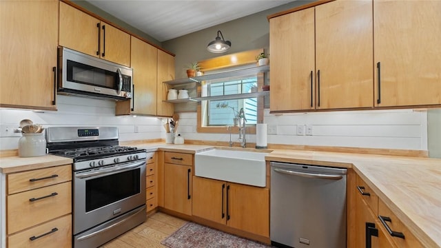 1806 Best Friend Ln, Fayetteville, AR 72704 - kitchen with stainless steel appliances, a sink, butcher block countertops, and open shelves