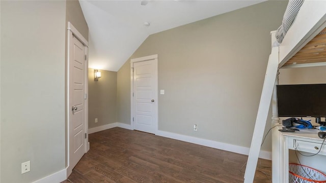 1806 Best Friend Ln, Fayetteville, AR 72704 - unfurnished bedroom with dark wood finished floors, lofted ceiling, and baseboards