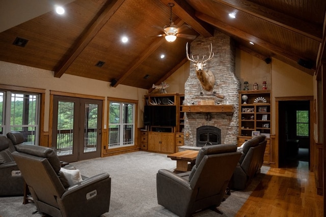 8295 Ridgecrest Ln, Rogers, AR 72756 - living area featuring high vaulted ceiling, wooden ceiling with exposed beams, wood finished floors, a stone fireplace, and recessed lighting