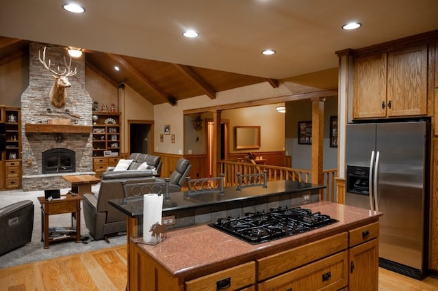 8295 Ridgecrest Ln, Rogers, AR 72756 - kitchen with stainless steel fridge with ice dispenser, black gas cooktop, light wood-style floors, wainscoting, and open floor plan