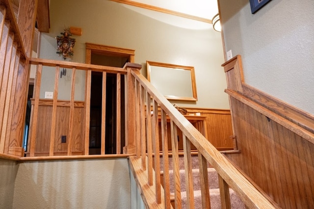 8295 Ridgecrest Ln, Rogers, AR 72756 - staircase with a wainscoted wall and wooden walls