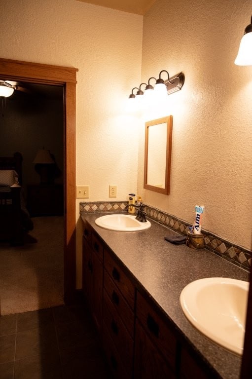 8295 Ridgecrest Ln, Rogers, AR 72756 - bathroom featuring double vanity, tile patterned flooring, and ceiling fan