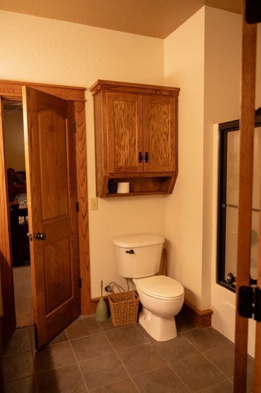 8295 Ridgecrest Ln, Rogers, AR 72756 - bathroom with toilet and tile patterned floors
