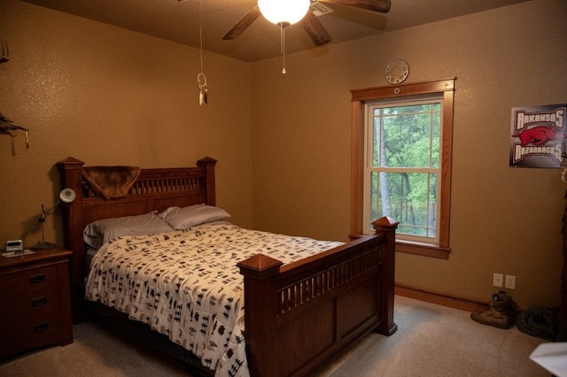 8295 Ridgecrest Ln, Rogers, AR 72756 - bedroom with light colored carpet and a ceiling fan