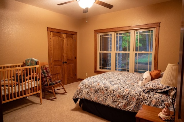 8295 Ridgecrest Ln, Rogers, AR 72756 - bedroom with carpet floors, a closet, ceiling fan, and a textured wall